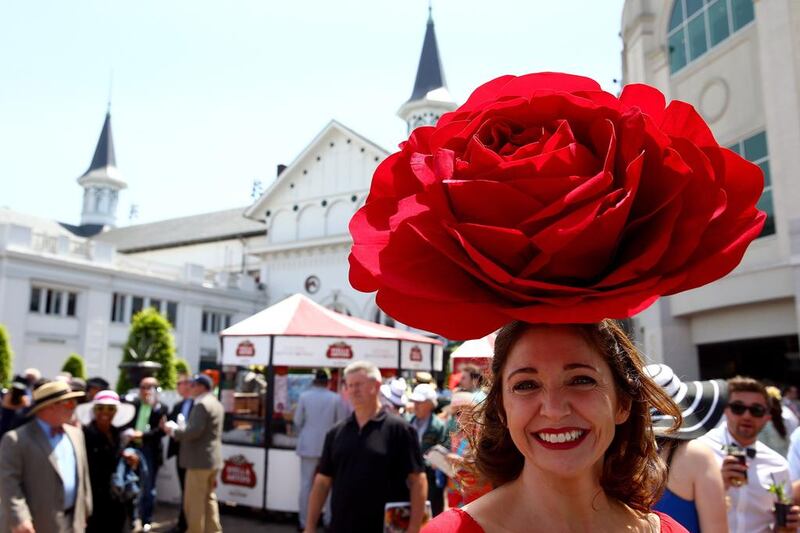 A race fan wearing a festive hat attends the 140th running of the Kentucky Derby. Andy Lyons / Getty Images / AFP
