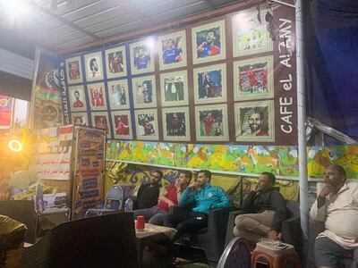 Customers watch the October 11 World Cup qualifier between Egypt and Libya at a cafe owned by a cousin of star footballer Mohamed Salah. Photo: Hamza Hendawi / The National