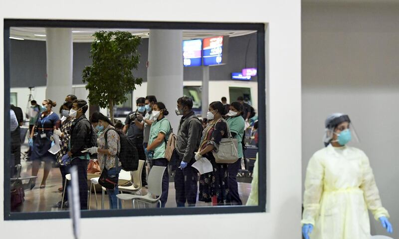 Members of an Indian medical team arrive at Dubai International Airport, to help with the coronavirus (COVID-19) pandemic.   AFP