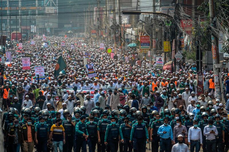 Activists and supporters of the Islami Andolon Bangladesh, a Islamist political party, hold a protest march calling for the boycott of French products in Dhaka.   AFP