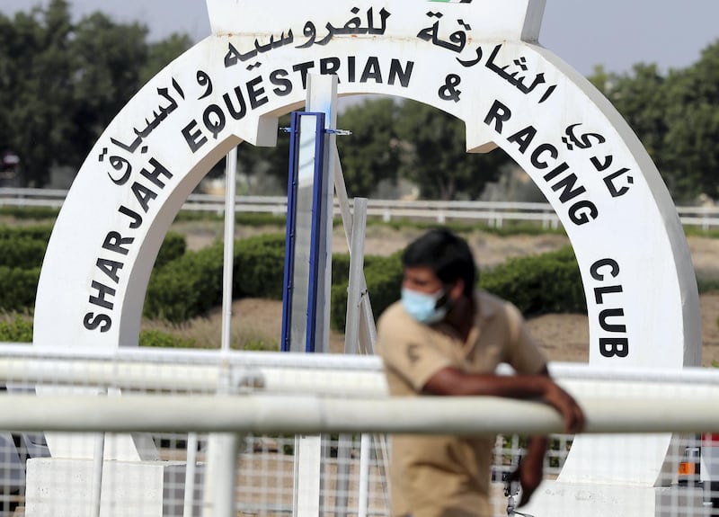 Sharjah, United Arab Emirates - November 28, 2020: People at Sharjah racecourse wear masks and keep social distancing to prevent the spread of Covid-19. Saturday, November 28th, 2020 in Sharjah. Chris Whiteoak / The National