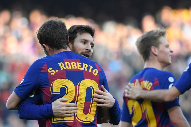 Barcelona's Sergi Roberto, left, after scoring against Getafe at Camp Nou. AFP