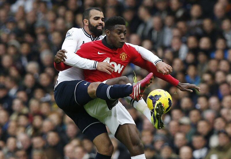 Tottenham's Sandro and Manchester United's Danny Welbeck vie for the ball during the two sides' match on Sunday. Sang Tan / AP