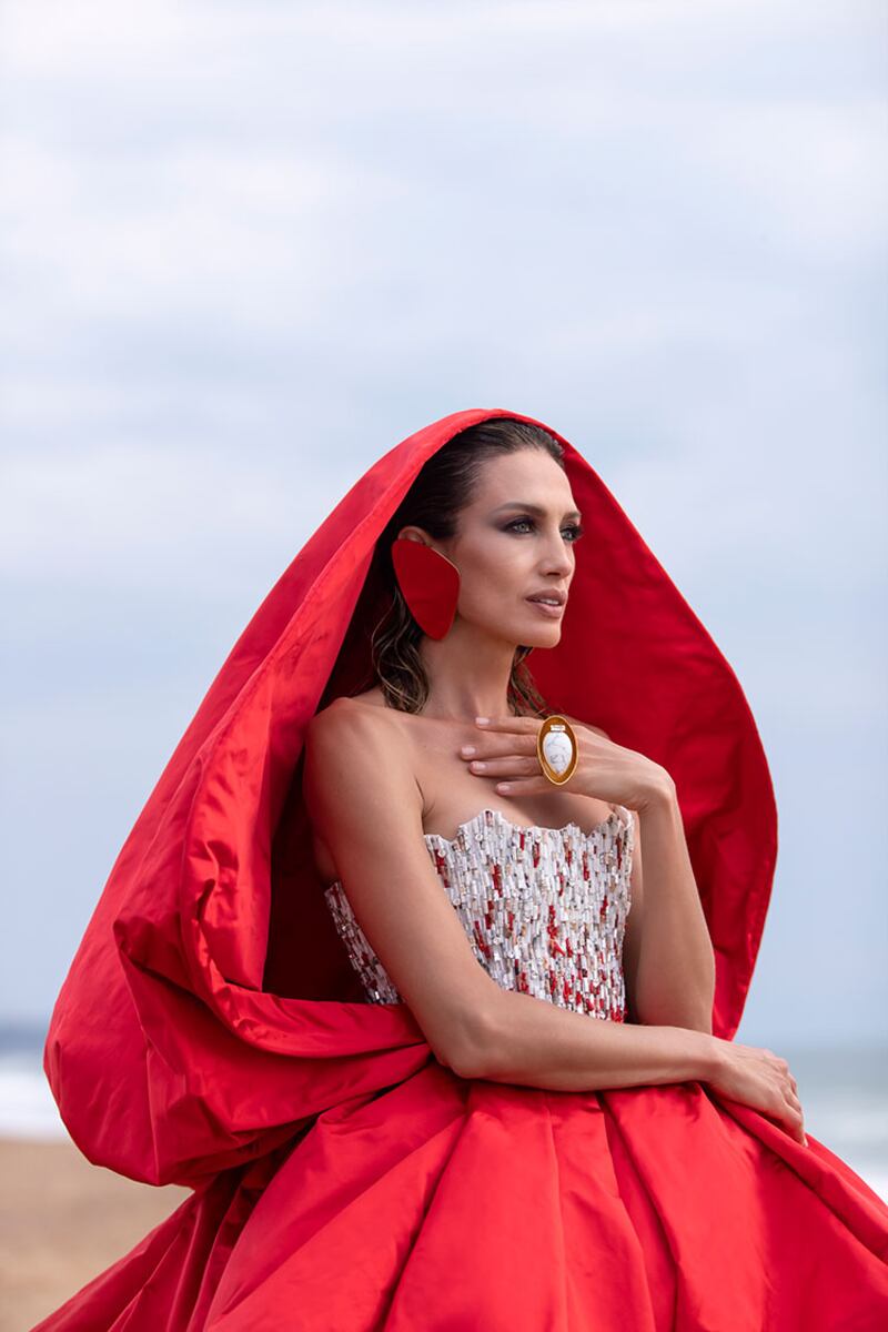 Mixing the drama of Little Red Riding Hood with beads of marble, crystal and red coral at  Stephane Rolland for haute couture autumn / winter 2021.