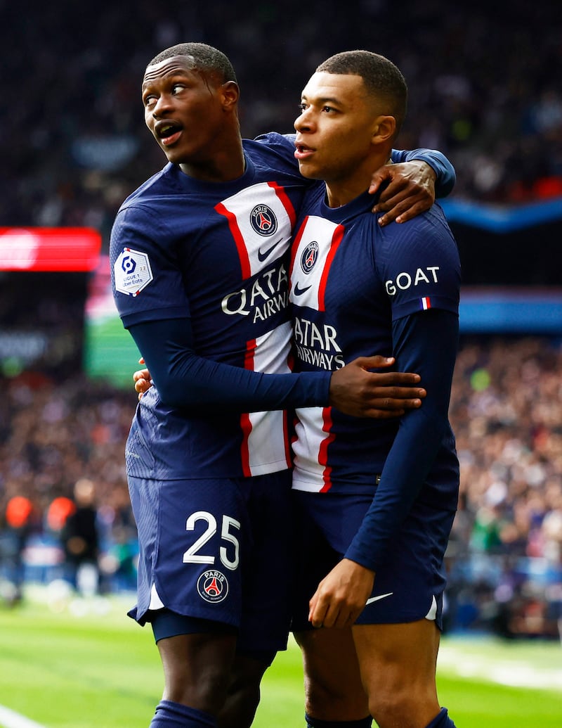 Kylian Mbappe celebrates scoring their first goal with Nuno Mendes. Reuters
