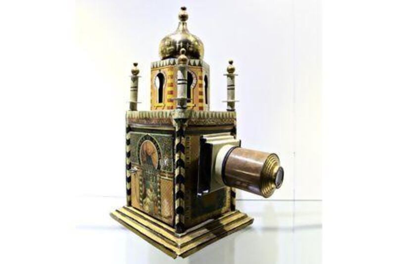 A 19th-century German toy magic lantern with a 1001 Knights Tale theme on display at the Dubai Moving Image Museum. Sarah Dea / The National
