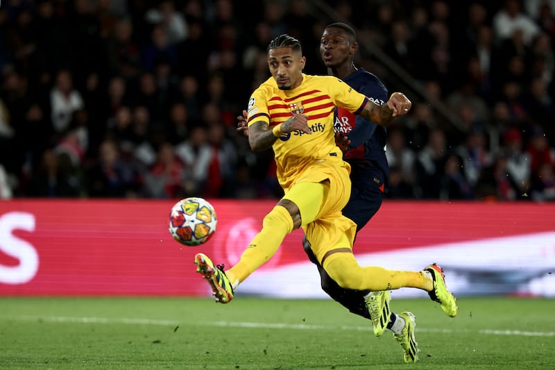 Raphinha volleys the ball to score Barcelona's second goal to make it 2-2 against PSG. AFP