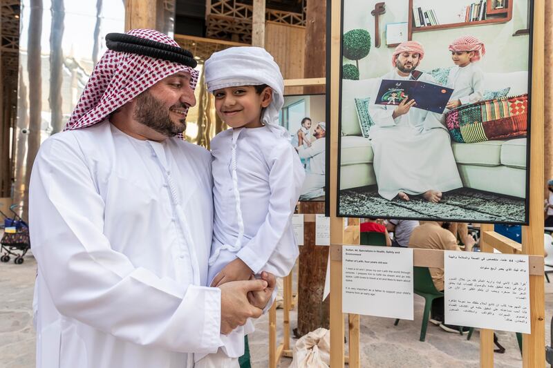 Sultan Karrani with his son Laith next to their photograph.