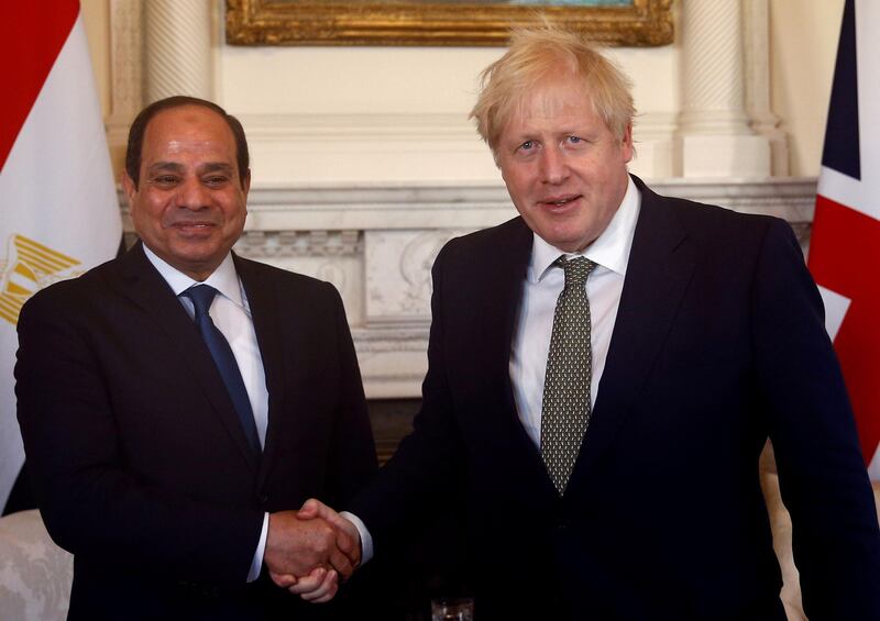 Britain's Prime Minister Boris Johnson shakes hands with President of Egypt Abdel Fattah el-Sisi inside 10 Downing Street in central London on January 21, 2020, ahead of their meeting.   / AFP / POOL / HENRY NICHOLLS
