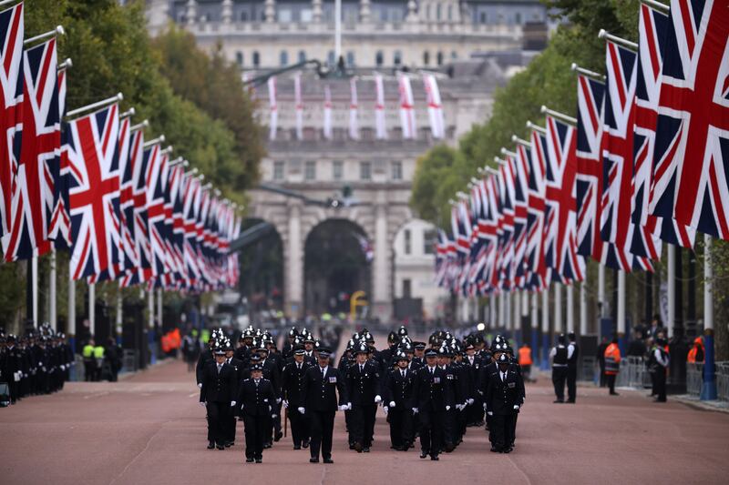 Metropolitan Police Officers walk in formation down The Mall in preparation for the state funeral Of Queen Elizabeth II. Getty 