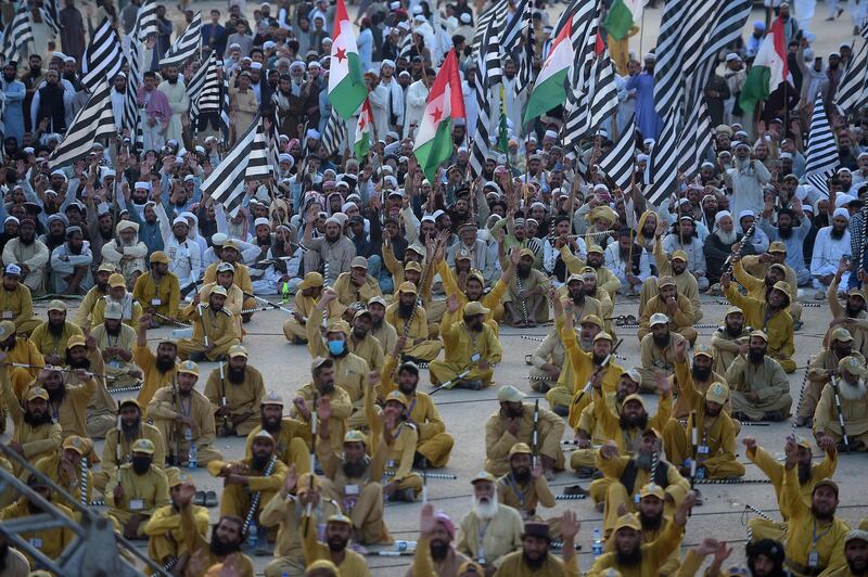 Supporters of JUI-F shout slogans during an anti-government march. AFP