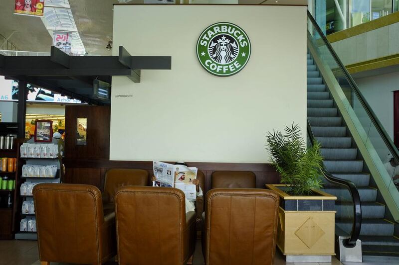 Some customers at mall coffee shops, including Starbucks in Al Jimi Mall, above, continue to light up in the mall despite a ban.  Razan Alzayani / The National