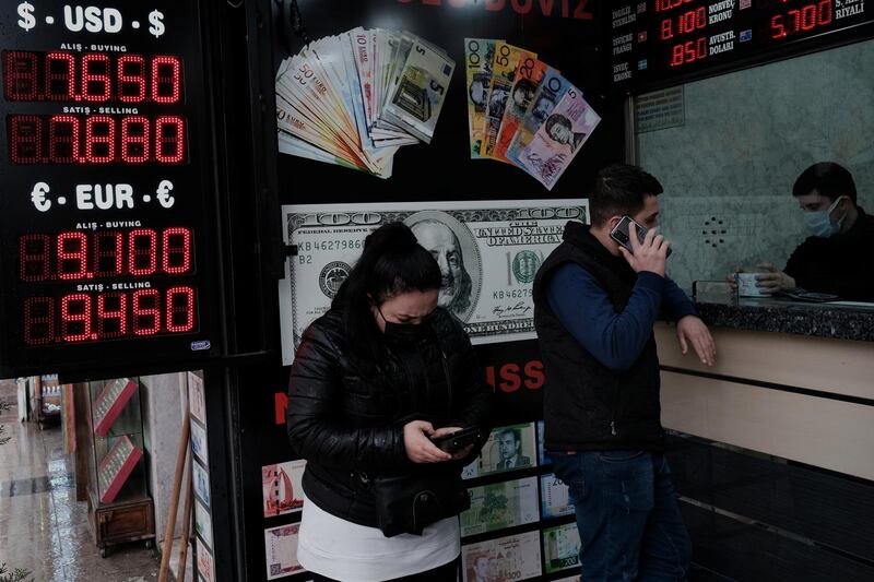 People wait to change money at a currency exchange office in Istanbul, Turkey. Reuters