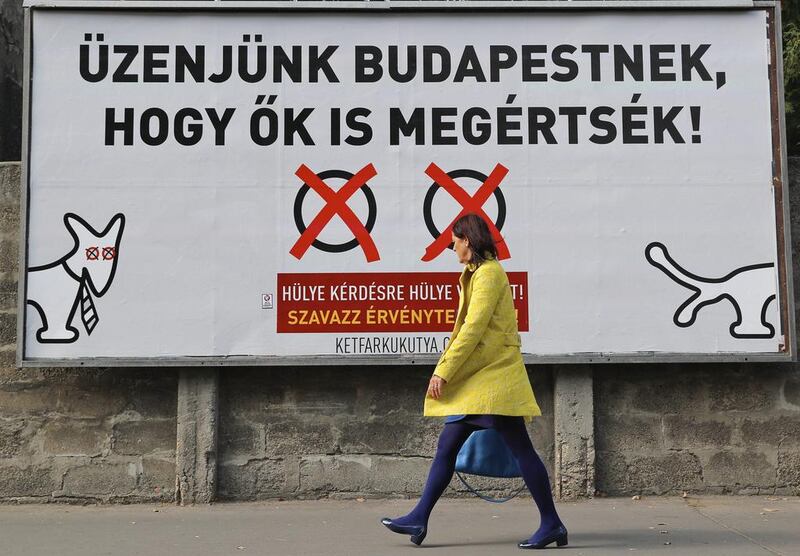 On October 1, 2016, the billboard poster in Budapest opposing the referendum on prime minister Viktor Orban's policy on migrants reads in Hungarian:  "Let's send a message to Budapest, so they also understand! A stupid answer to a stupid question! Cast an invalid vote!"  Vadim Ghirda / AP 