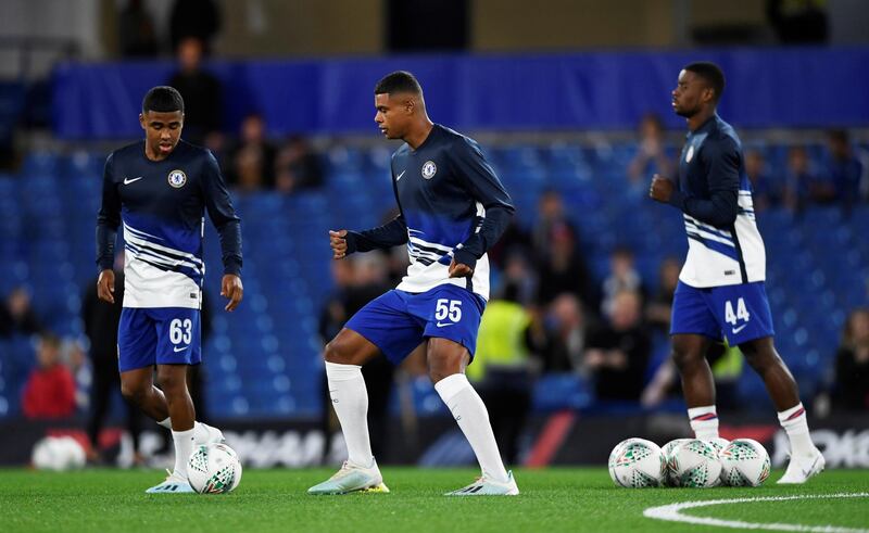 Chelsea youth team players Faustino Anjorin, Ian Maatsen and Marc Guehi during the warm up before the match against Grimsby. Reuters