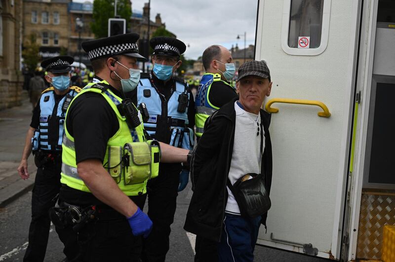 A far right protestor is arrested. AFP