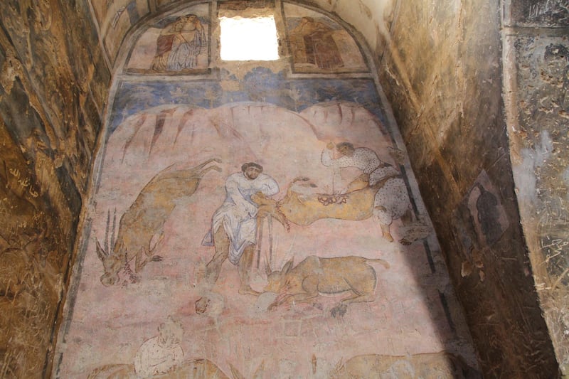 Colourful paintings depicting daily life were  restored by Italian archaeologists. Amy McConaghy / The National