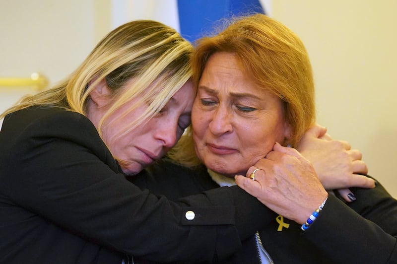 Avivit Yablonka, left, sister of Chanan Yablonka, hugs Orit Meir, mother of Almog Meir, during a press conference at the Israeli embassy in London with family members of seven hostages taken by Hamas. AP