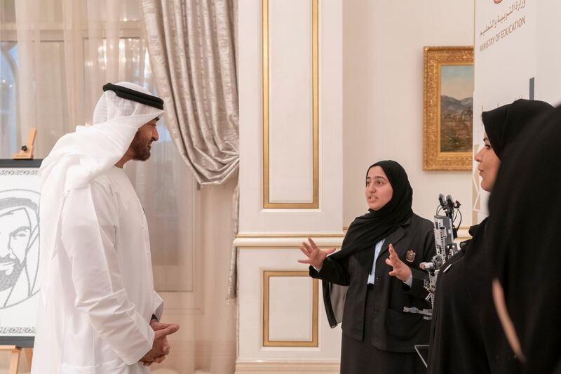 ABU DHABI, UNITED ARAB EMIRATES - October 23, 2018: HH Sheikh Mohamed bin Zayed Al Nahyan Crown Prince of Abu Dhabi Deputy Supreme Commander of the UAE Armed Forces (L), views the projects of the winners of The National Science, Technology and Innovation Festival, during a Sea Palace barza. 

(Rashed Al Mansoori / Crown Prince Court - Abu Dhabi )
---