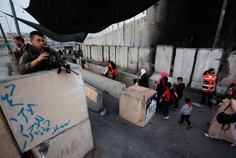 Palestinians cross the Qalandia checkpoint in the occupied West Bank on their way to the first Friday prayers of Ramadan at Jerusalem's Al Aqsa Mosque. Reuters