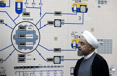 FILE - In this Jan. 13, 2015, file photo released by the Iranian President's Office, President Hassan Rouhani visits the Bushehr nuclear power plant just outside of Bushehr, Iran. Rouhani is reportedly set to announce ways the Islamic Republic will react to continued U.S. pressure after President Donald Trump pulled America from Tehranâ€™s nuclear deal with world powers. Iranian media say Rouhani is expected to deliver a nationwide address as soon as Wednesday, May 8, 2019, regarding the steps the country will take. (AP Photo/Iranian Presidency Office, Mohammad Berno, File)