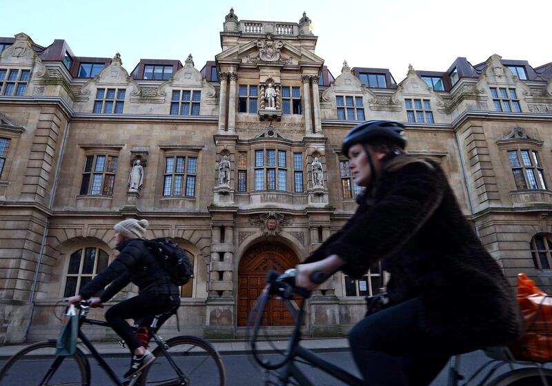 OXFORD, ENGLAND - FEBRUARY 02: Cyclists ride past a statue of Cecil Rhodes displayed on the front of on Oriel College on February 2, 2016 in Oxford, England. Oriel College has decided to keep its statue of Cecil Rhodes despite the Rhodes Must Fall campaign. (Photo by Carl Court/Getty Images)