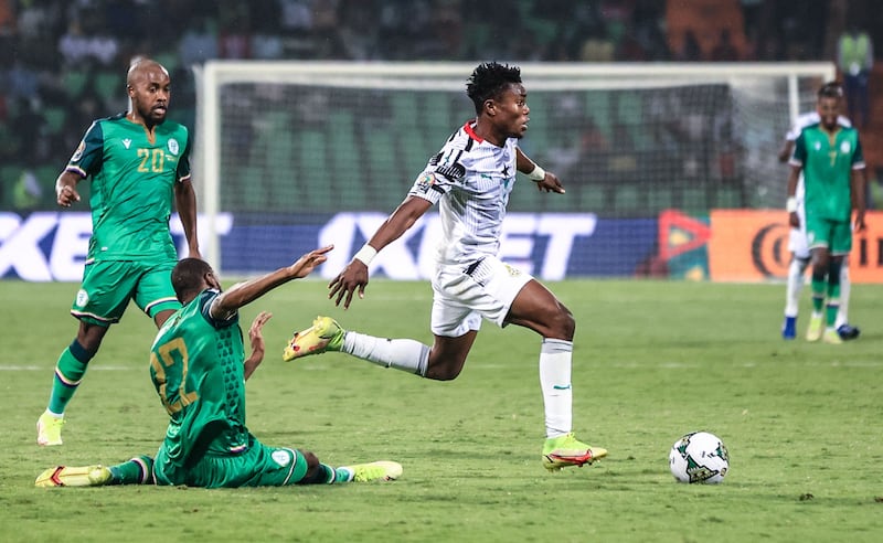 Ghana goalkeeper Abdul Manaf Nurudeen fights for the ball with Comoros forward Said Bakari. AFP