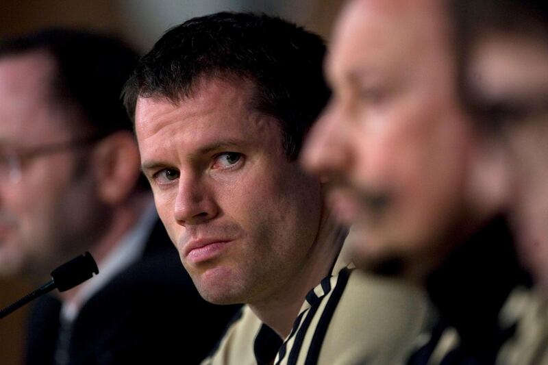 FILE - This is a Tuesday, Feb. 24, 2009 file photo of  Liverpool's Jamie Carragher as he listens to a question during a press conference ahead of a Champions League, Round of 16, first leg soccer match against Real Madrid at the Santiago Bernabeu Stadium in Madrid. The Sky television network Monday March 12, 2018 suspended soccer announcer Jamie Carragher after the former Liverpool player was filmed spitting in the direction of a 14-year-old girl through his car window. The incident happened Saturday after Carragher left Old Trafford. He had been there working for Sky Sports at Manchester United's game against Liverpool. (AP Photo/Arturo Rodriguez/File)
