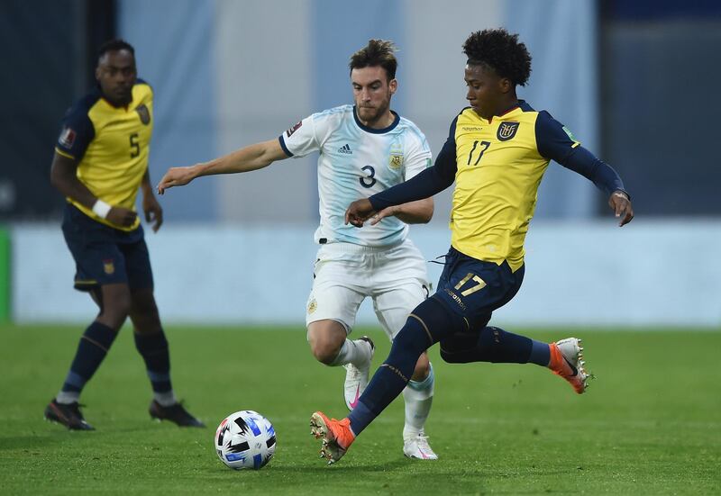 Nicolas Tagliafico, left, Argentina vies for the ball with Angelo Preciado of Ecuador. EPA