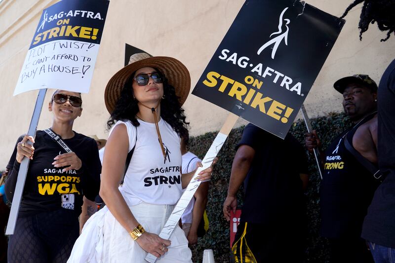 Vanessa Hudgens joins a protest outside Warner Bros Studios, Los Angeles. AP