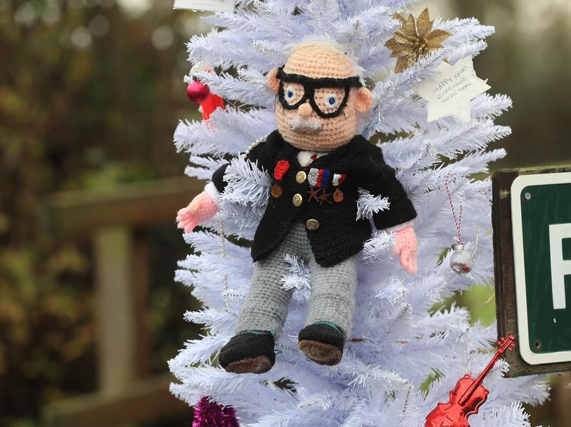 PA via Reuters
A hand knitted Christmas bauble of Captain Sir Tom Moore hangs on the village Christmas tree in the centre of Allington, Lincolnshire.No Use UK. No Use Ireland. No Use Belgium. No Use France. No Use Germany. No Use Japan. No Use China. No Use Norway. No Use Sweden. No Use Denmark. No Use Holland. No Use Australia.