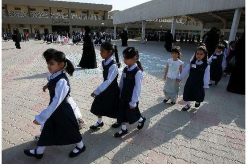 Students at Dubai's Jumeirah Model Girls School head to class from the assembly.