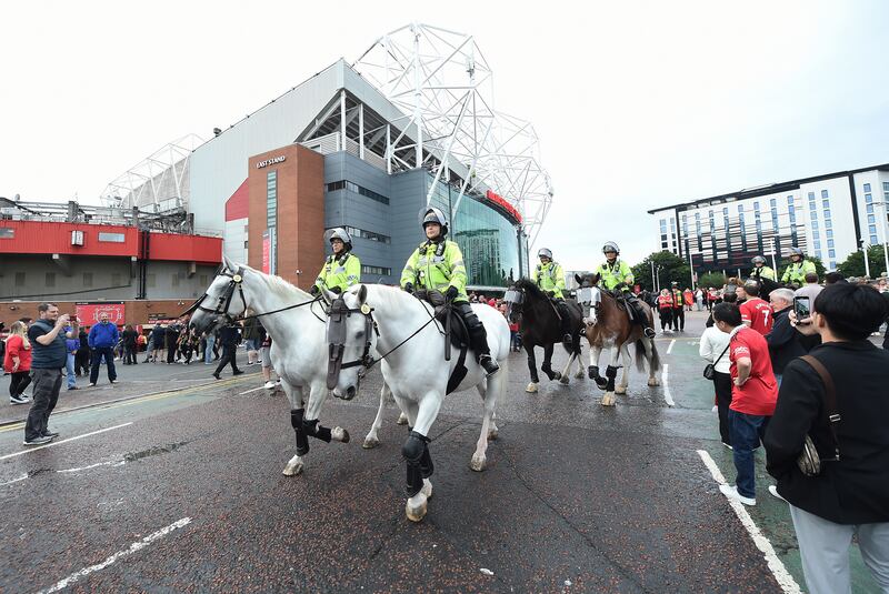 Fans arrive amidst high police security. EPA