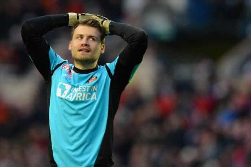 At 25, Simon Mignolet could be the long-term option to replace the veteran Pepe Reina. Andrew Yates / AFP