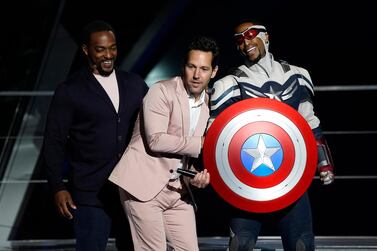 Anthony Mackie, left, and his character Captain America, right, appear on stage with Paul Rudd at the Avengers Campus dedication ceremony at Disney's California Adventure Park on Wednesday, June 2, 2021, in Anaheim, Calif. (AP Photo/Chris Pizzello)