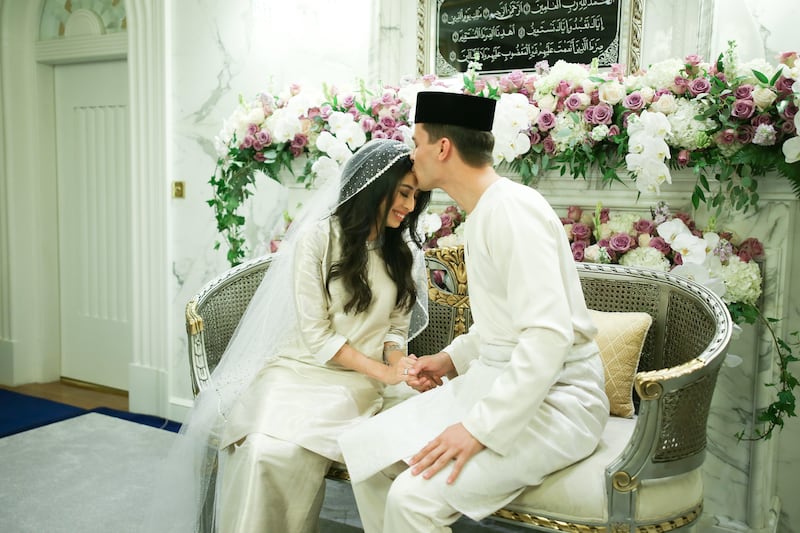 epa06143694 A handout photo made available by the Johor Royal Press Office shows the groom Dutchman Dennis Muhammad (R) kissing the forehead of his wife Johor Princess Tunku Tun Aminah Maimunah Iskandariah Sultan Ibrahim after their marriage solemnization ceremony at the Serene Hill Palace in Johor Bahru, Malaysia, 14 August 2017. Johor Princess Tunku Tun Aminah Sultan Ibrahim and Dutch-born Dennis Muhammad Abdullah were pronounced husband and wife on 14 August 2017, after their solemnization of marriage according to Malay customs. The Royal Press Office said the ritual was witnessed by Johor Sultan Ibrahim Iskandar and his consort Raja Zarith Sofiah Idris Shah as well as close family members and friends.  EPA/JOHOR ROYAL PRESS OFFICE HANDOUT  HANDOUT EDITORIAL USE ONLY/NO SALES