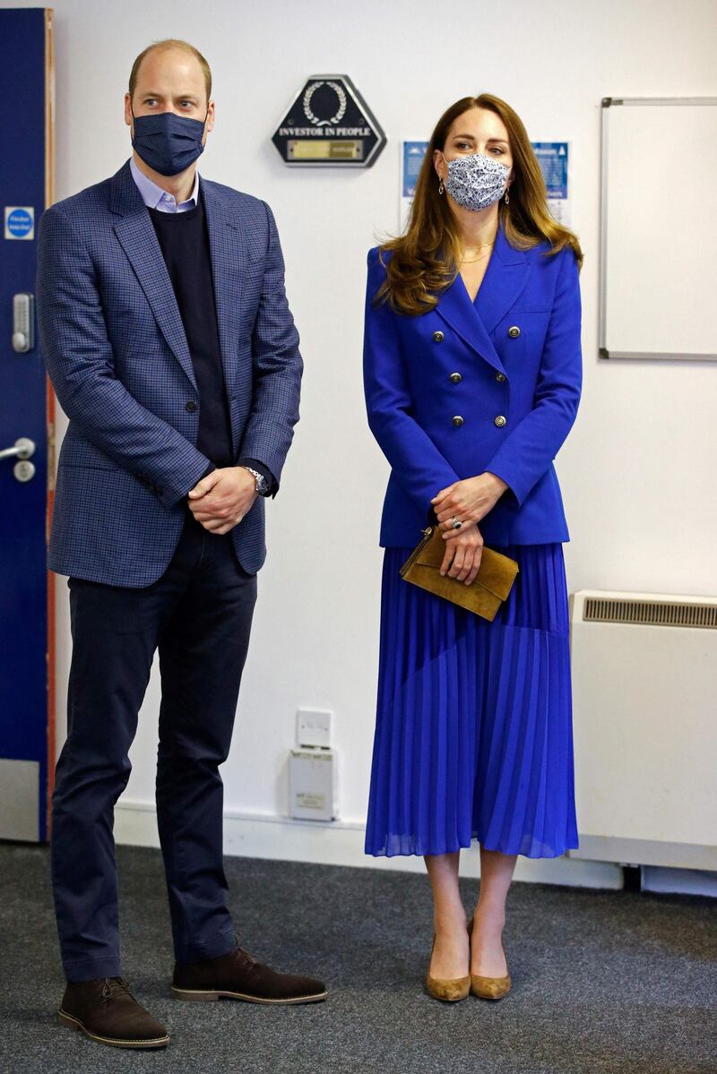 Kate wears a bright blue outfit—the color of the national flag of Scotland—with a blazer from Zara and a skirt by clothing brand Hope.Phil Noble / AFP