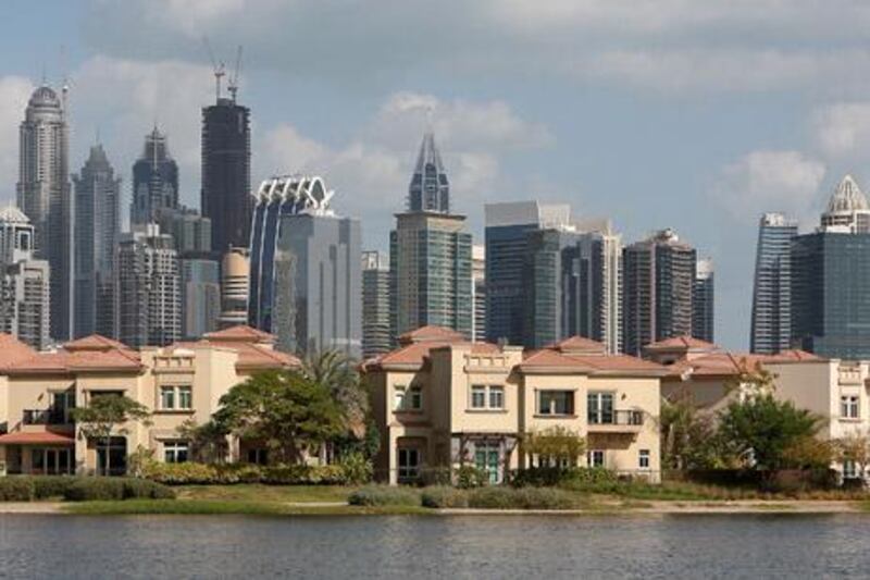 
DUBAI , UNITED ARAB EMIRATES Ð Jan 24 : View of the villas in the Jumeirah Island in Dubai. Jumeirah Lake Towers are also seen in background. ( Pawan Singh / The National ) For Stock
