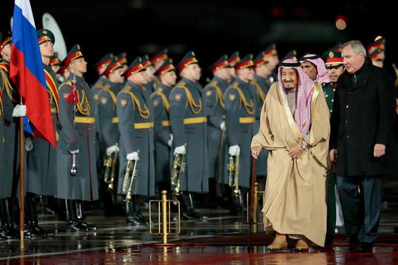 Saudi King Salman, second right, and Russian Deputy Prime Minister Dmitry Rogozin, right, review an honor guard upon arrival in Moscow's Government Vnukovo airport, Russia, Wednesday, Oct. 4, 2017. Salman will meet Russian President Vladimir Putin on Thursday, Oct. 5, 2017. (AP Photo/Ivan Sekretarev)