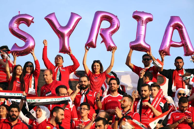 Syria supporters wait for the start of the match. AFP