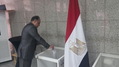 Egyptian ambassador to the UAE Wael Gad is the first to vote at the embassy in Abu Dhabi, UAE.