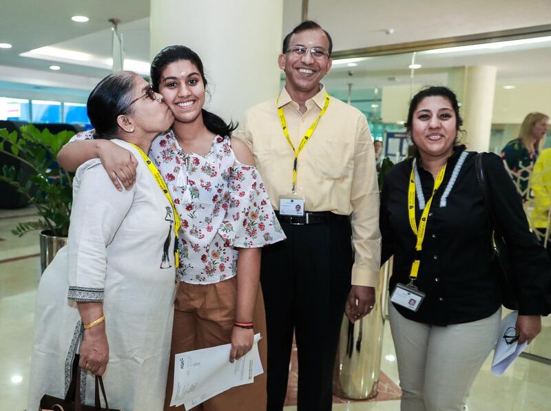 Dubai, U.A.E., August 23 , 2018.  GCSE results coverage at the GEMS Wellington International School.  Shriti Krishnamoorthy-16
gets a kiss from her grandmother, Vishwanathan together with father, Krishnamoorthy and mother, Hema.
Victor Besa/The National
Section:  NA
Reporter:  Nick Webster