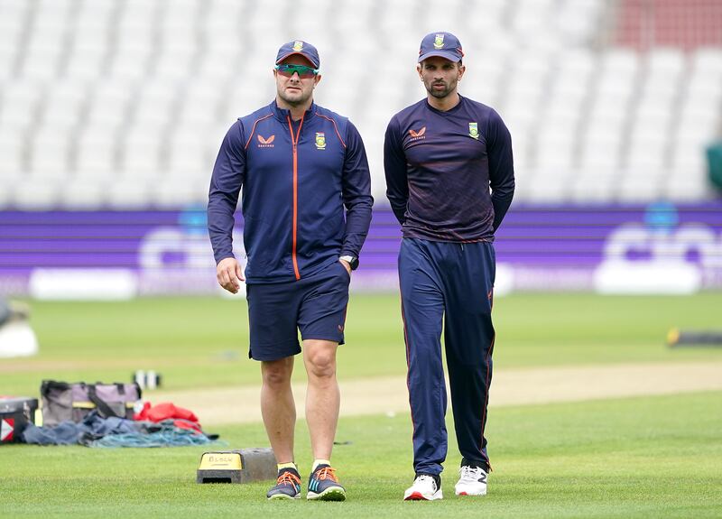 South Africa coach Mark Boucher, left, and captain Keshav Maharaj. PA