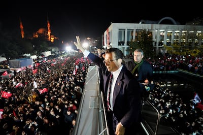 Istanbul Mayor Ekrem Imamoglu on Wednesday greets his supporters in front of his office after a Turkish court sentenced him to more than two years in prison and imposed a political ban for insulting public officials. Reuters