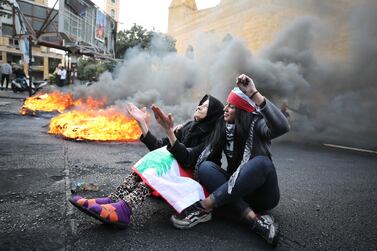 Two women at a protest in Beirut.