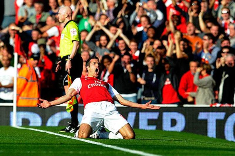 Robin van Persie, celebrates coming off the bench to score two goals to save Arsenal from a disappointing result in their 3-1 win against Stoke.

Tom Hevezi  / AP Photo