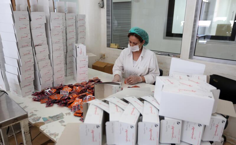 A laboratory technician packs Azithromycin tablets at Syrian Tamico Pharmaceutical Factory. Youssef Badawi / EPA