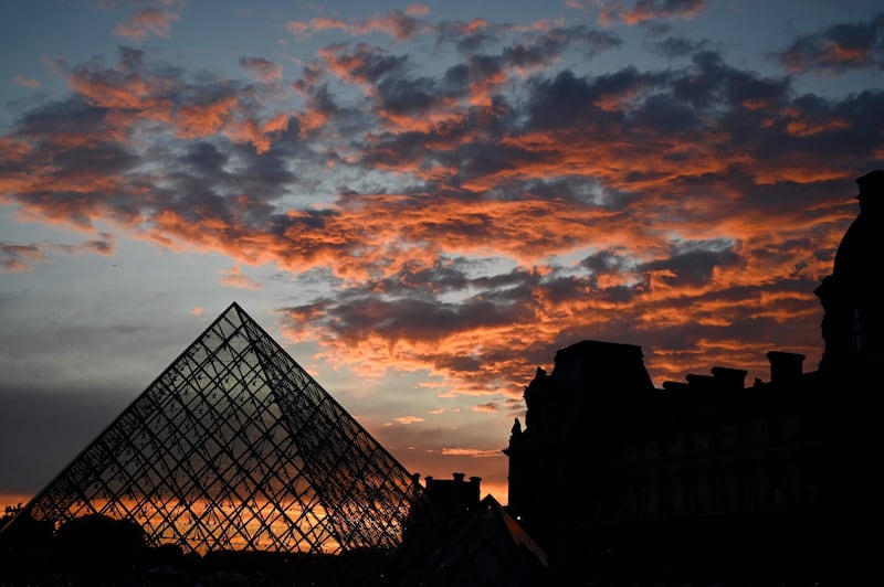 The Louvre Pyramid at sunset, in Paris. AFP