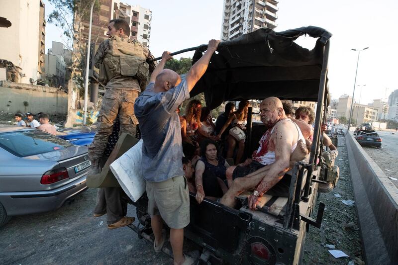Injured people are rescued after a massive explosion in Beirut. AP Photo