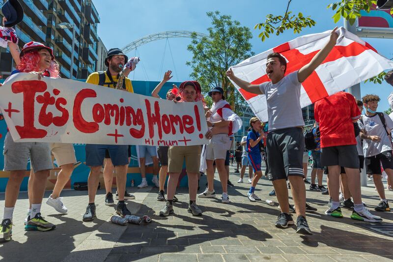 England fans chant Football’s Coming Home outside Wembley. Alamy